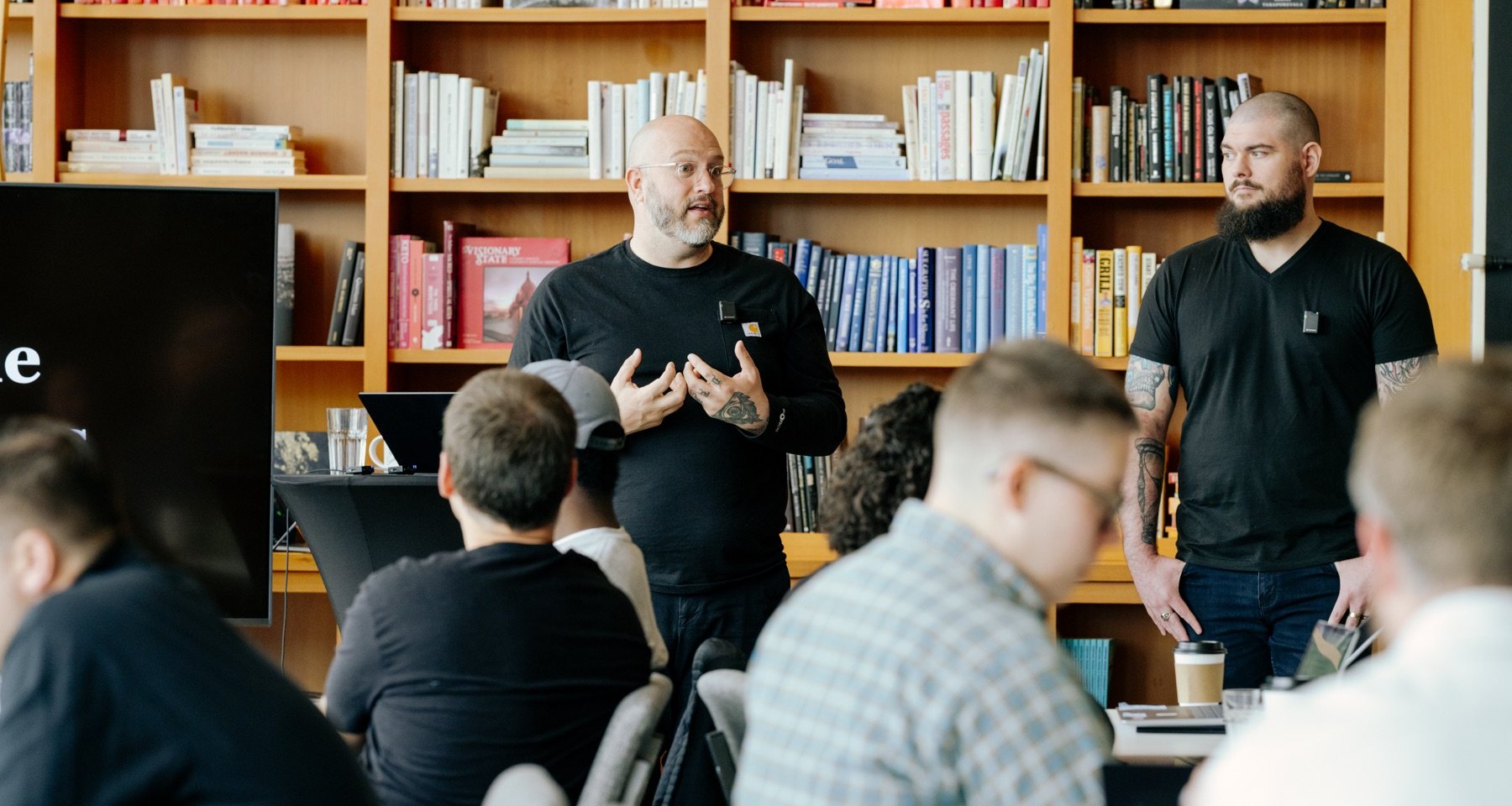 Darrell Vesterfelt and Corey Wilks leading a live session with a room of founders